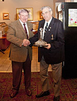 Derek presents Fred Patman with a decanter for 18 years as Chairman